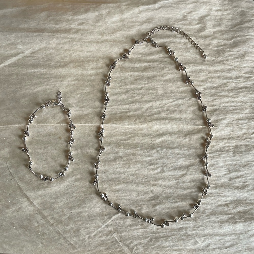 Matching silver necklace and bracelet